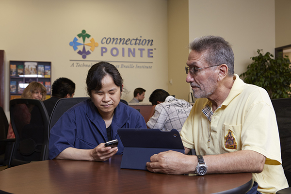 Teacher working with student a the Baille Institute