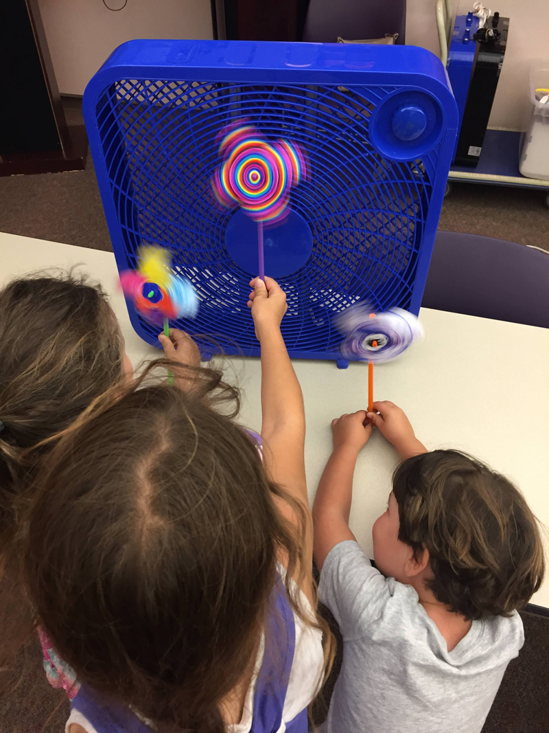 Children building a wind energy turbine with straws 